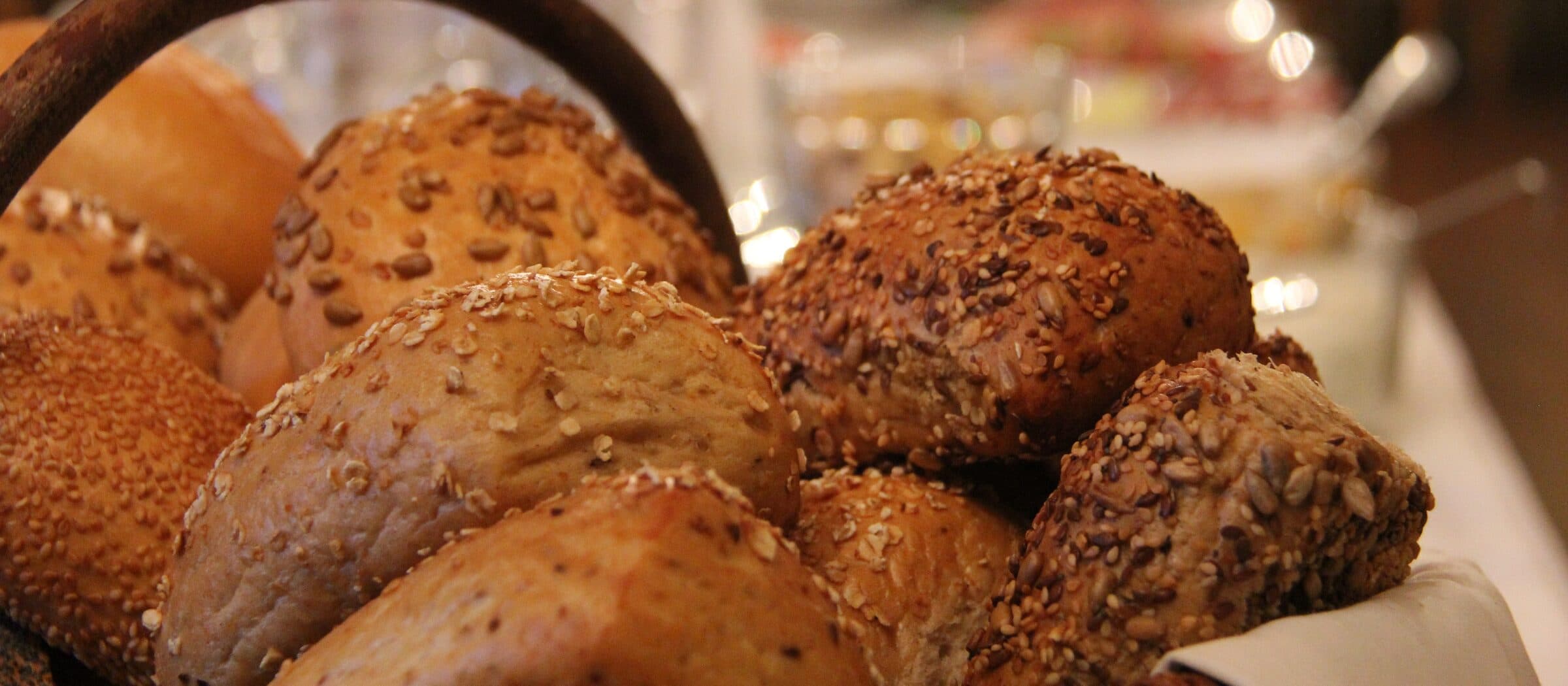 Basket of crusty rolls on the breakfast table at Das Vitalhotel Schulenberg